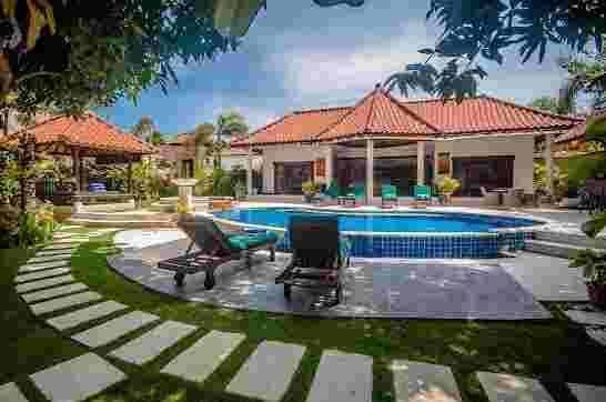 Two-story tropical retreat at Villa Bugis, offering modern comfort in the heart of Luxury Villas Seminyak.