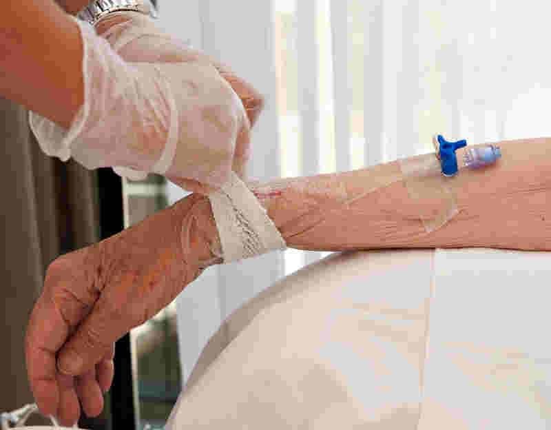 Senior patient receiving IV infusion in Pererenan and Canggu for health support